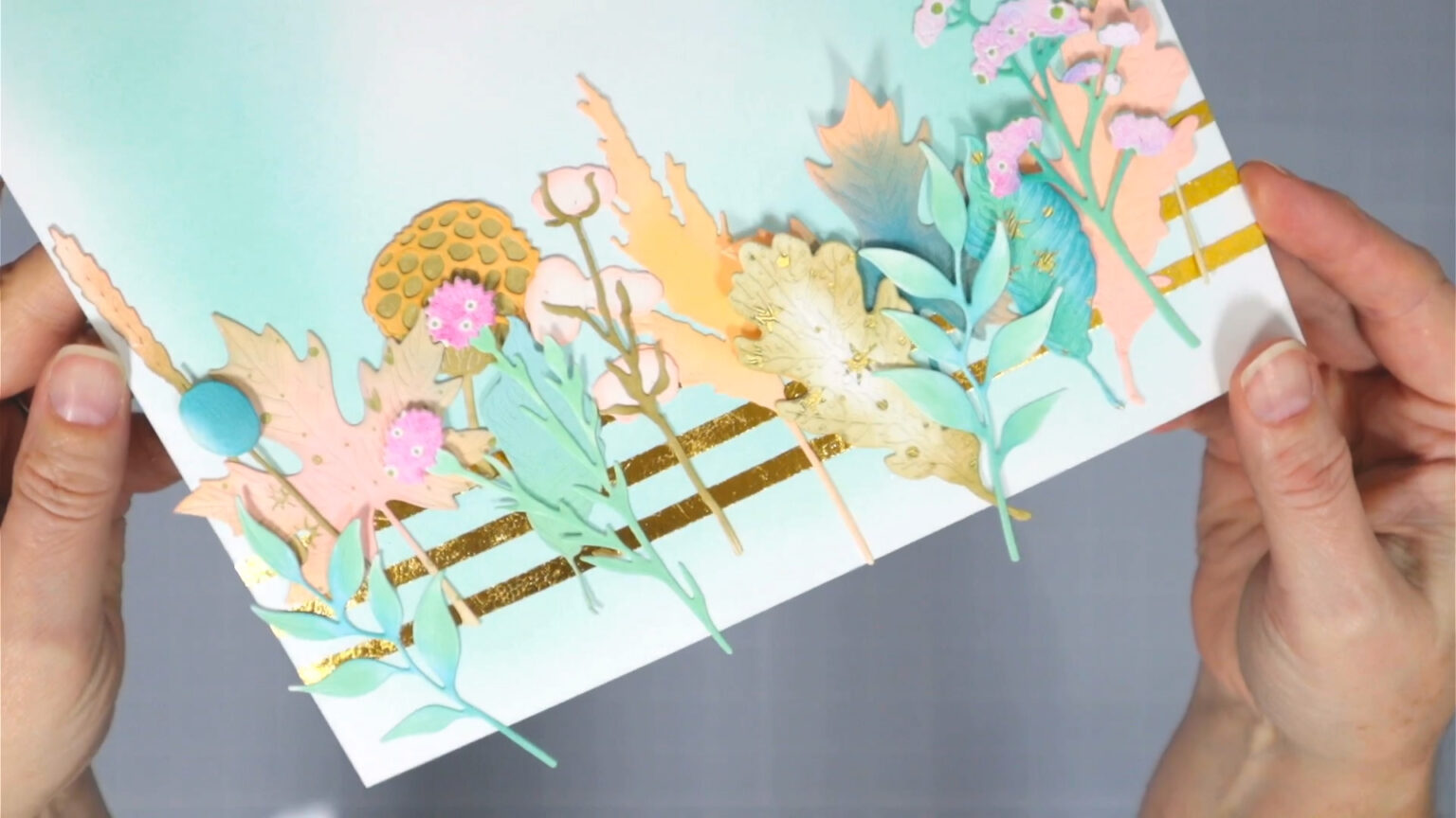 Floral border made of mixed media die cut pieces.