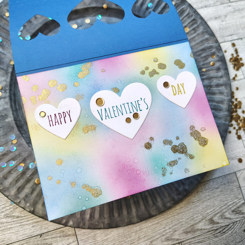 A colorful mixed media panel inside a card.