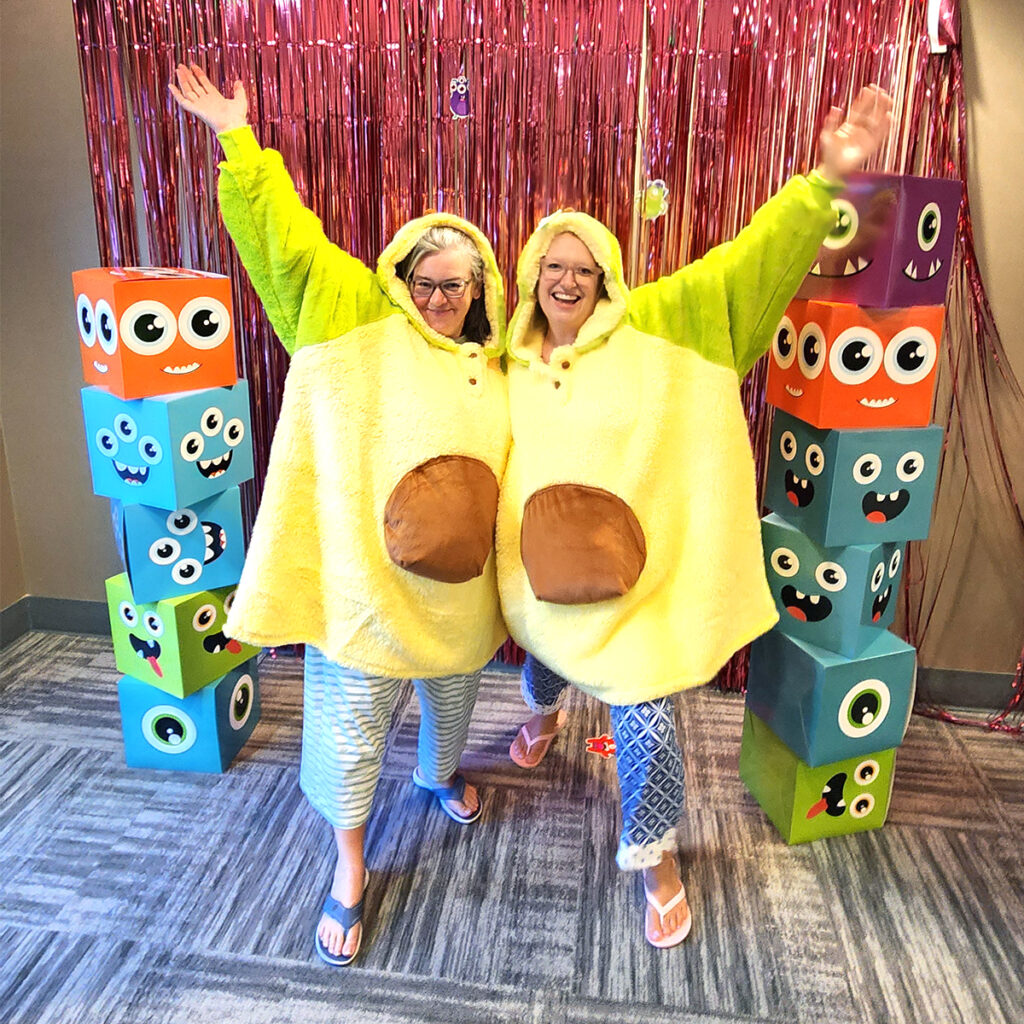 Women dressed up in avocado costumes.